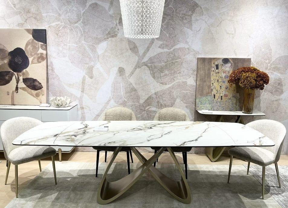 Patagonia dining table top made of sintered  stone having no facia with Matt finished infinity shaped  metal leg Real
