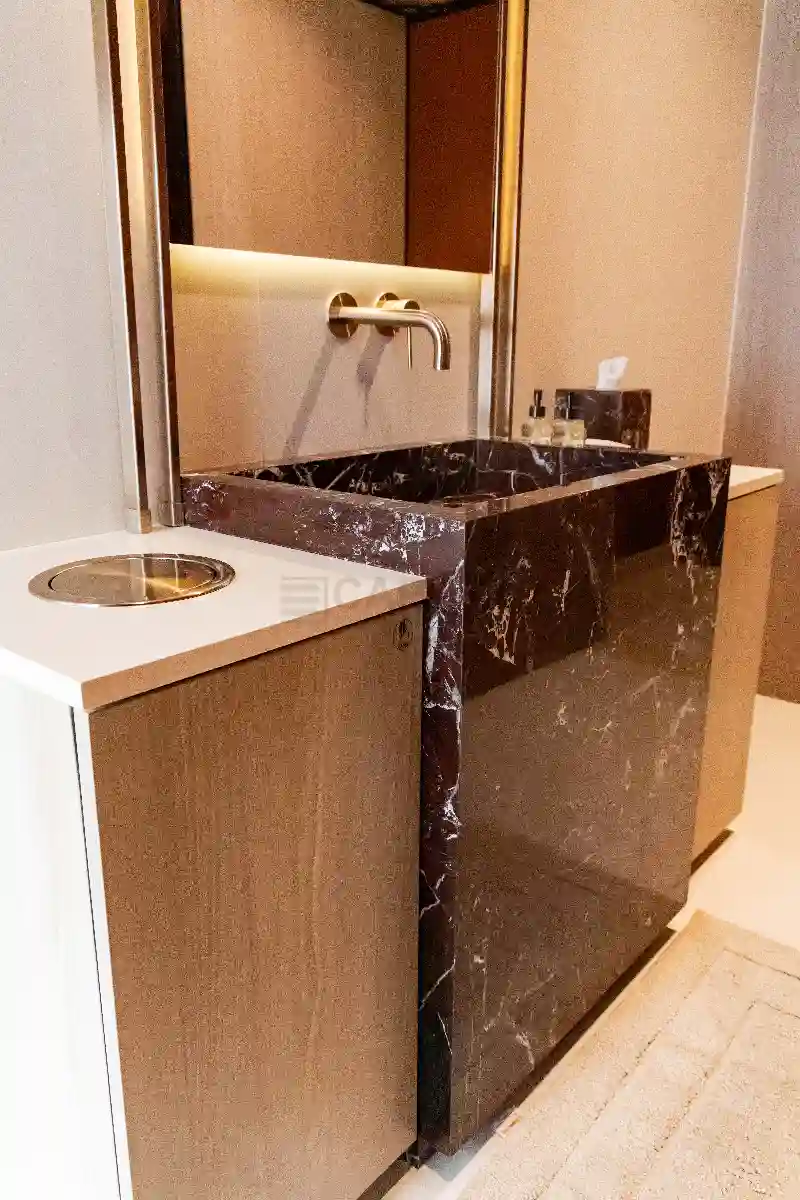 Countertop Waste Chute and Monolithic Porcelain Edge Detailing